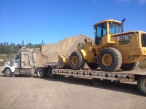 deere equipment on back of trailer